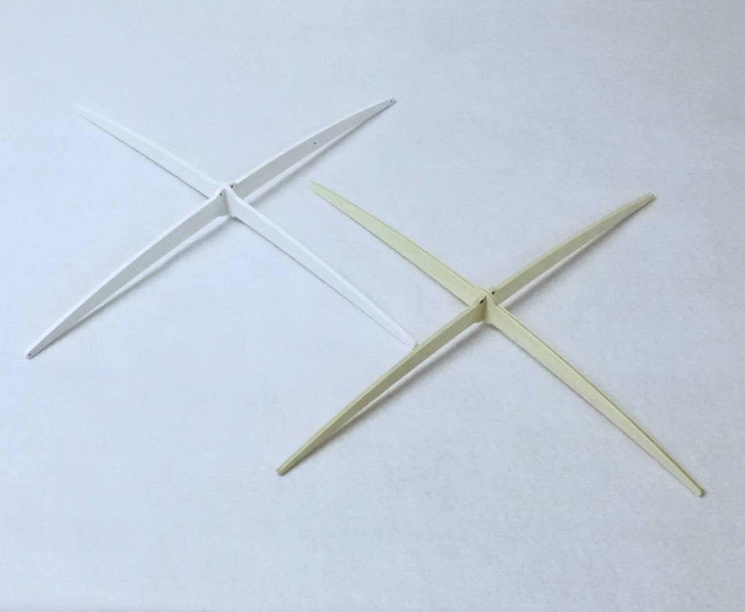 Detail of the exclusive cross-style mobile hanger used in many Happy Little Cloud baby mobiles.