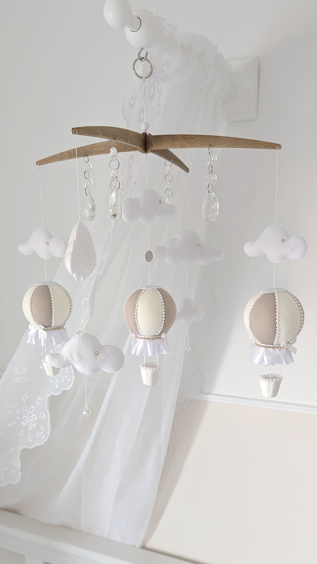 Complete nursery set with coordinating hot air balloon mobile and wall balloons in gentle ivory and taupe.


