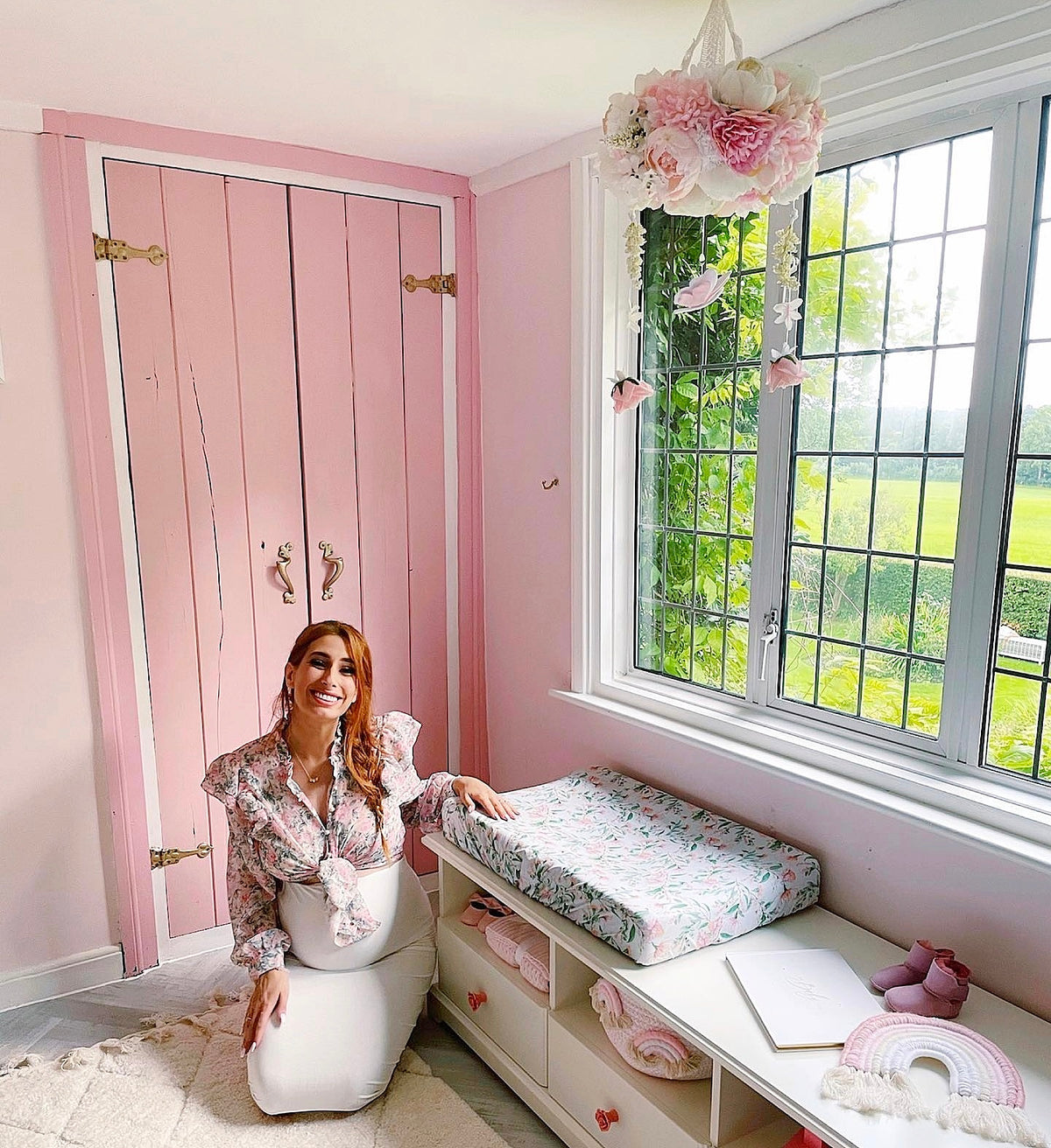 Floral mobile featured in Stacey Solomon’s nursery, adorned with pink peonies, butterflies, and soft garden-inspired elements.

