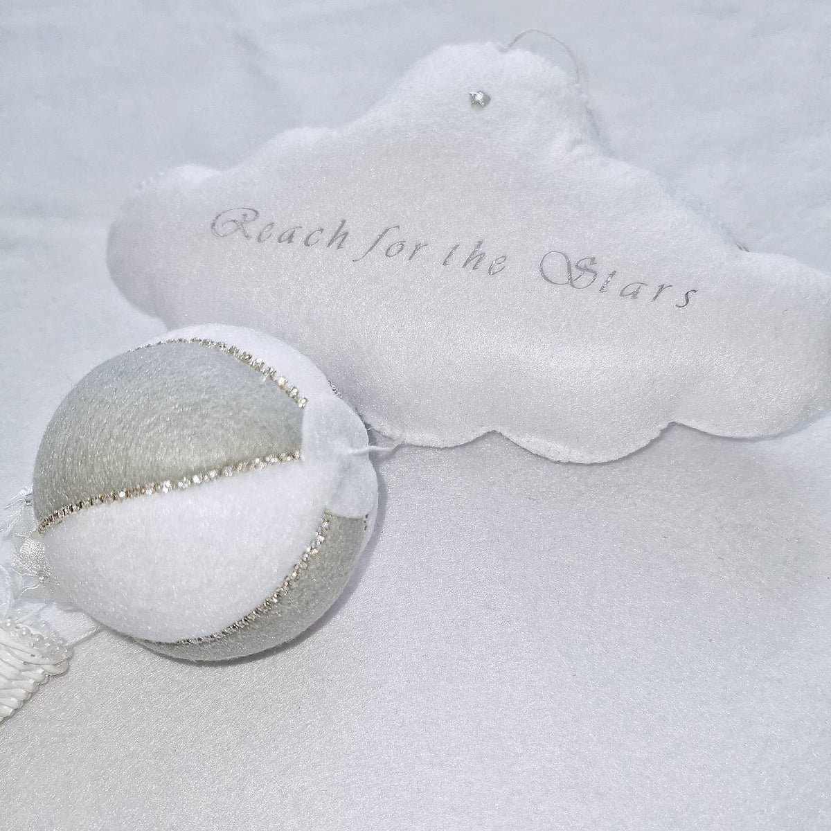 Handcrafted balloon with pearl detailing and cloud embroidery—designed as a keepsake gift for little dreamers.

