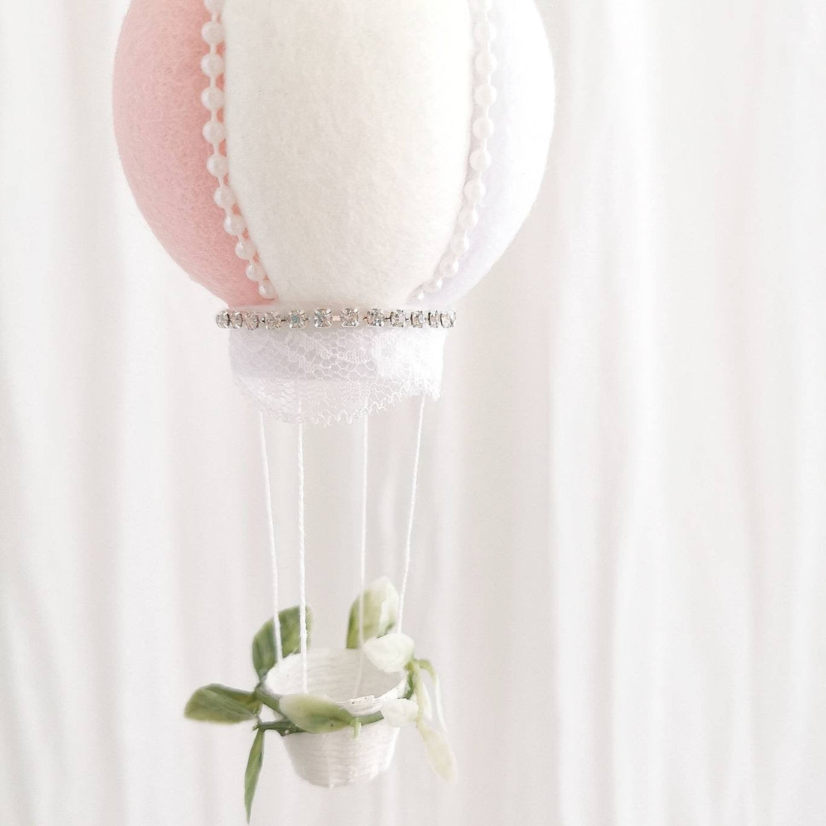 Heirloom luxury baby mobile with faux roses, ruffled peonies, and a exclusive hot air balloon in blush and white