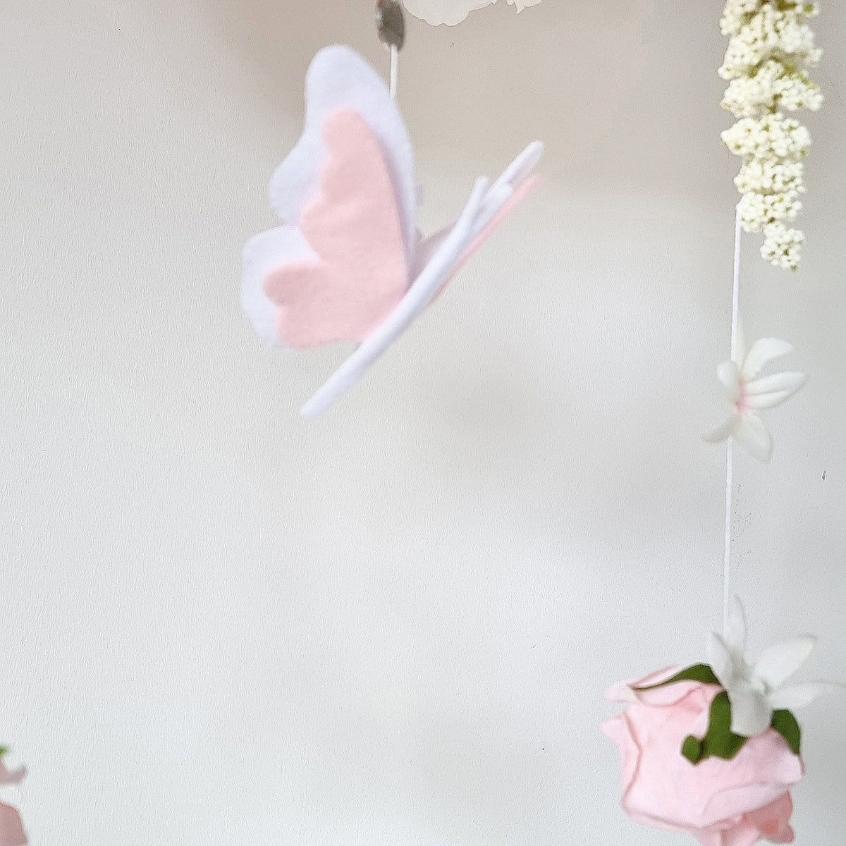 Lush garden-style baby mobile with cascading florals and floral buds, perfect for a luxury baby girl nursery.