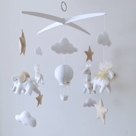 Luxury safari baby mobile featuring handmade felt elephant, lion, giraffe, stars, clouds, and hot air balloon, perfect for neutral nursery decor.

